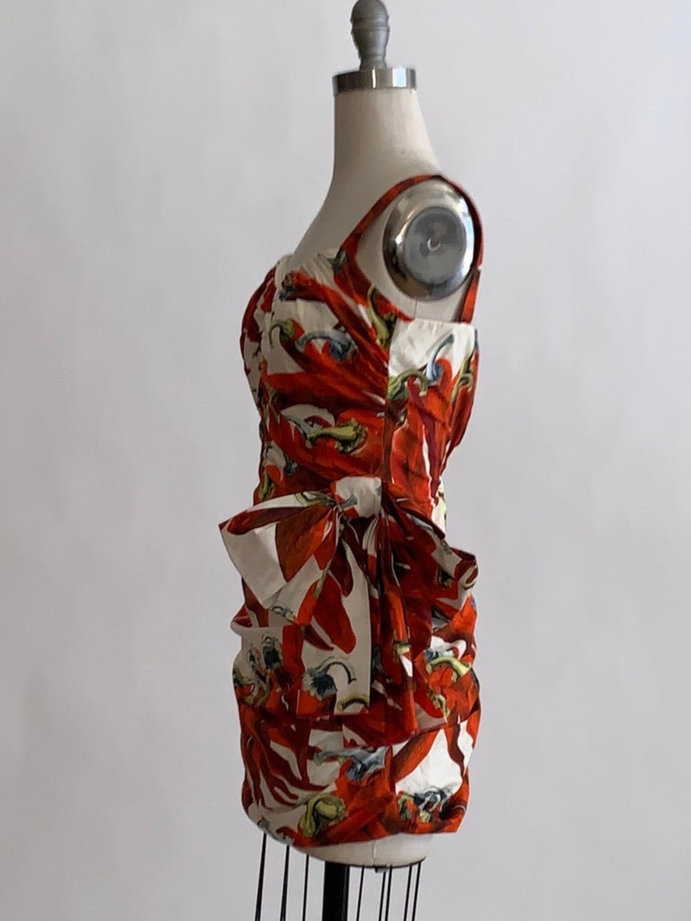 Red chili pepper print ruched mini dress featuring a side bow accent - Picture 3 of 10